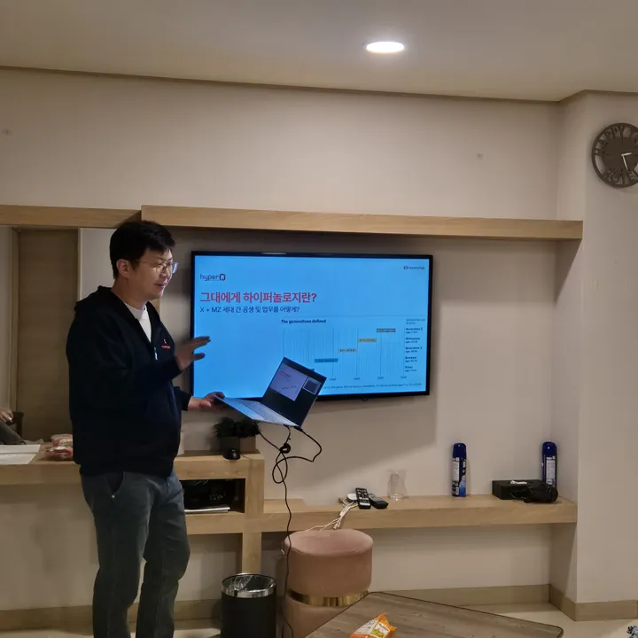 A team member giving a talk at the workshop on how generations work together